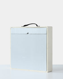 Wooden art shipping crate with a front foam panel insert and a black fabric handle, designed for safe transportation of fine art.