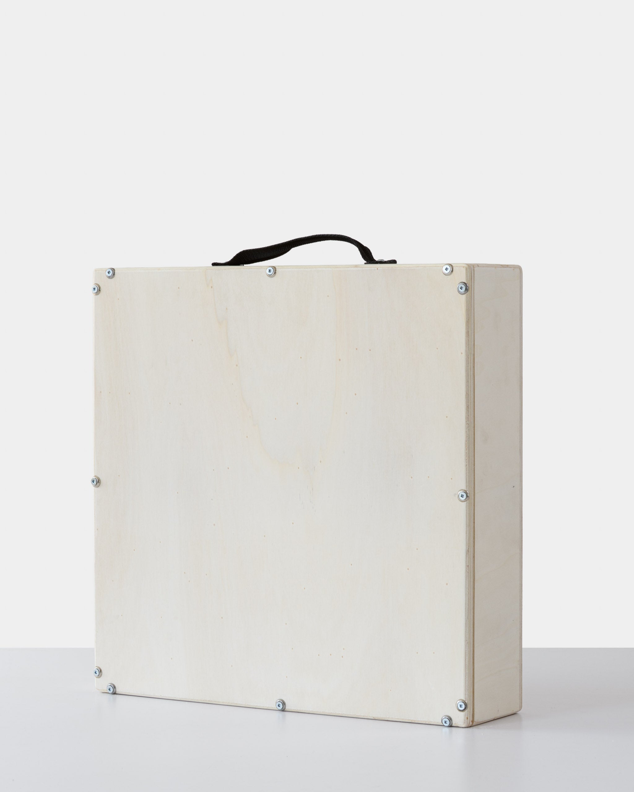 Rear view of a secure wooden crate for artwork, with visible screws and a black handle for easy carrying.