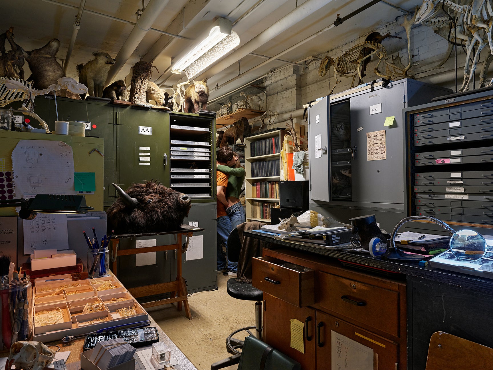 Photograph of a storage room of a school with sutdents fooling around